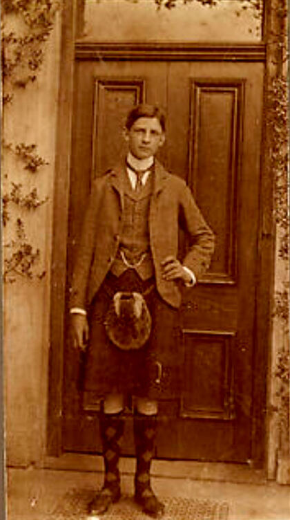 A young Davy in a kilt at the Lodge door, c.1890s