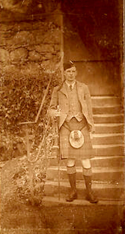 A young Davy in a kilt on the garden steps, c.1890s