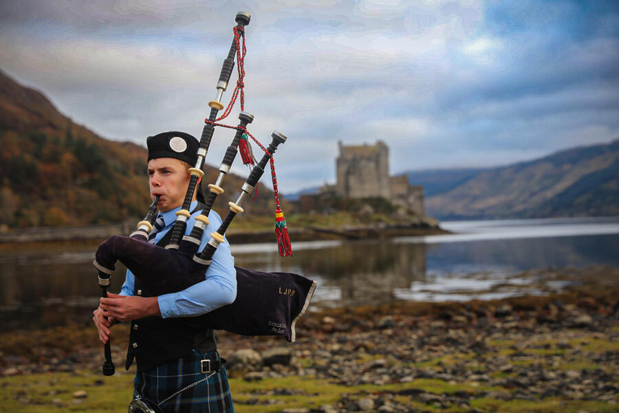 Piper at Eilean Donan Castle