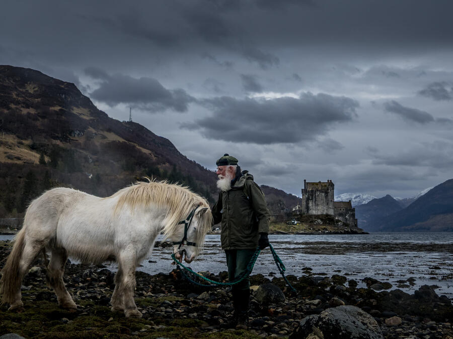 Poet Tony Bonning with Chief, at Eilean Donan Castle